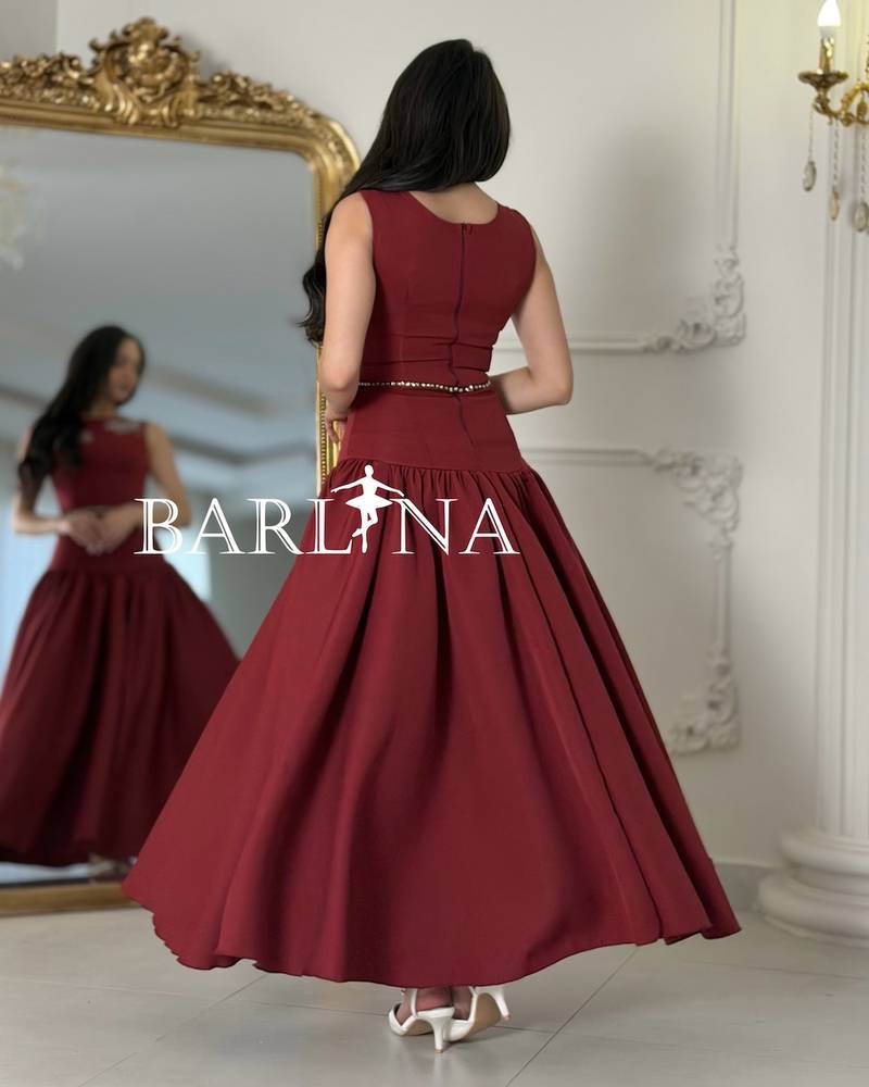 Long burgundy flared dress with a low waist
