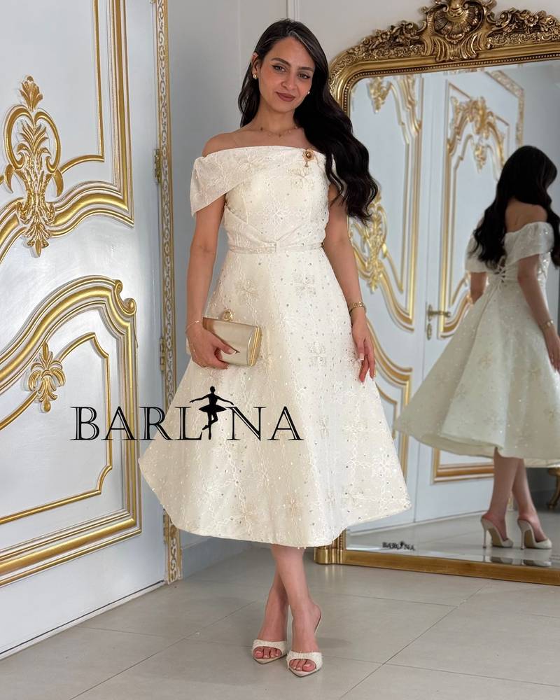 Off-white midi dress with a subtle sheen