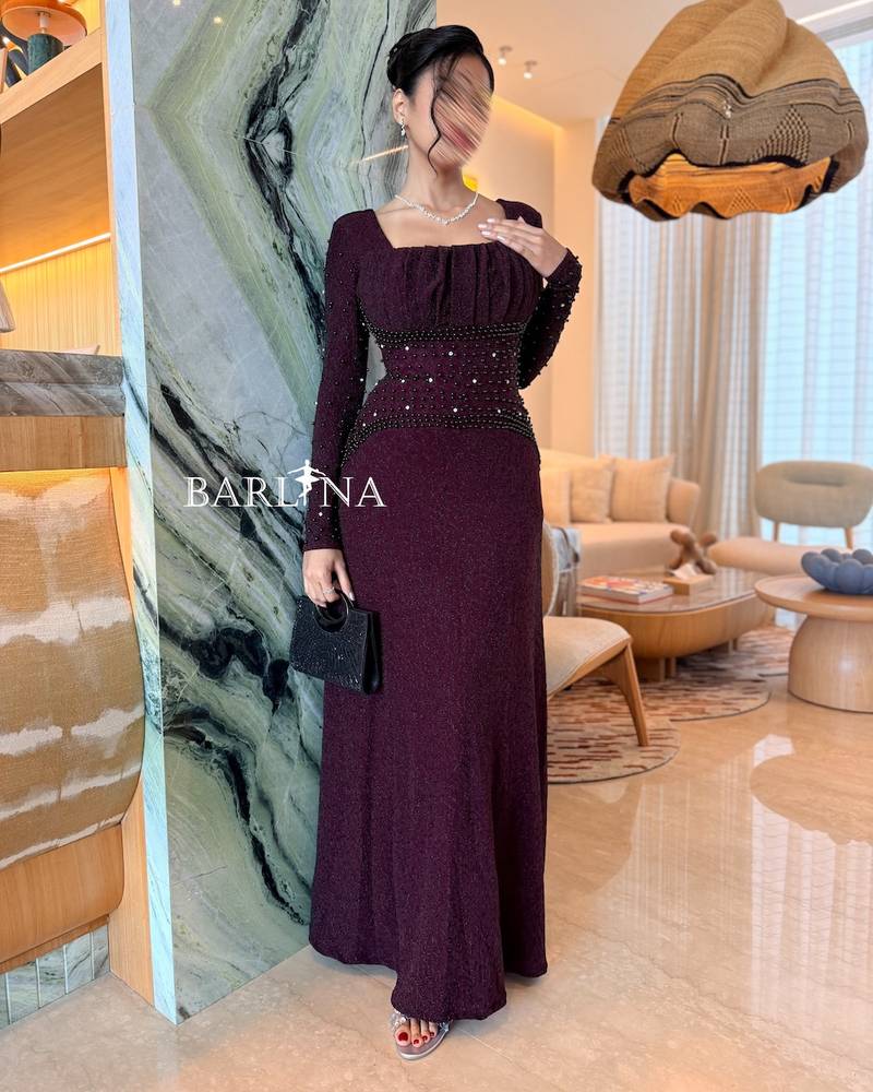 Burgundy dress with a square neckline adorned with pleats