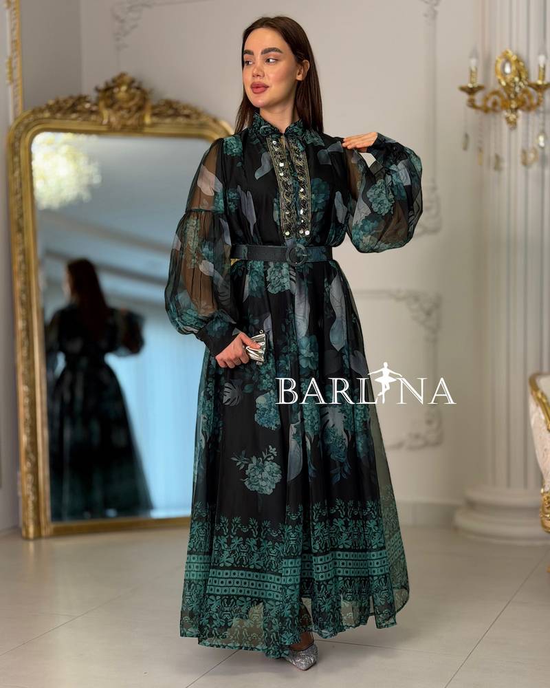 Long black dress with a green pattern