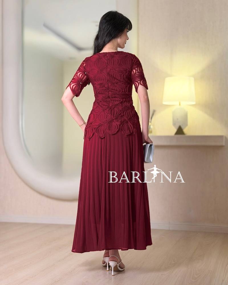 Soft pleated dress with embroidered bodice