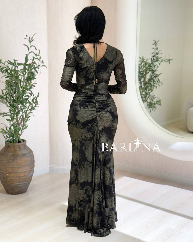 A black dress with an elegant pattern and a fitted silhouette.
