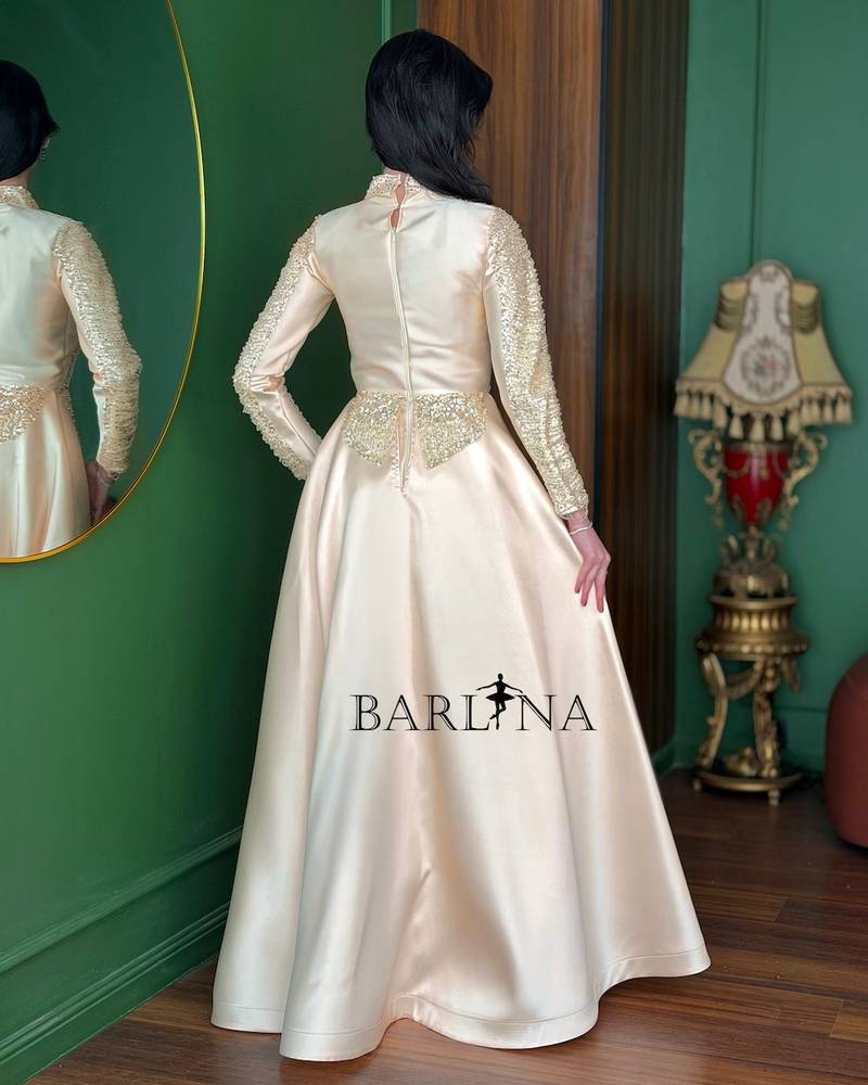 Cream gold-beaded dress with a back train