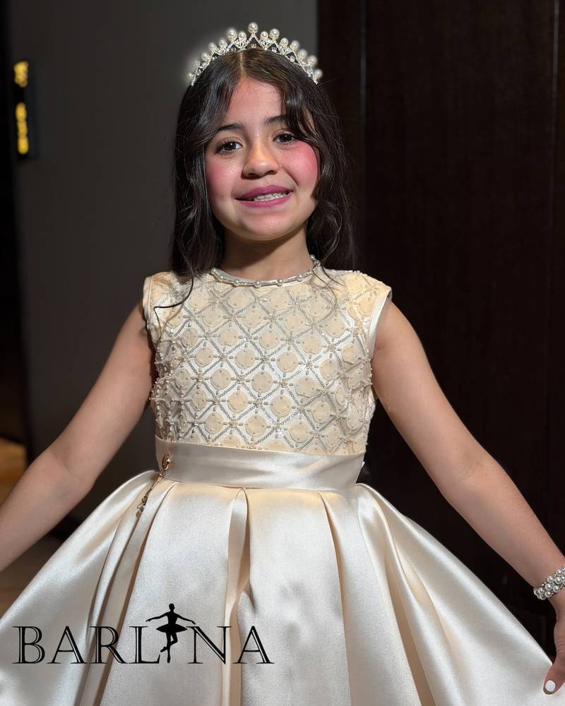 Beige girls' dress with a gold embroidered bodice