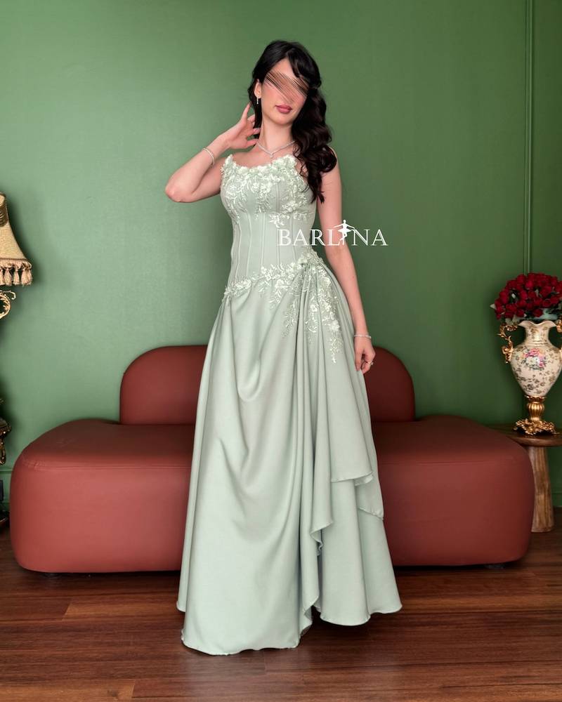 Pistachio green dress with a gathered waist design