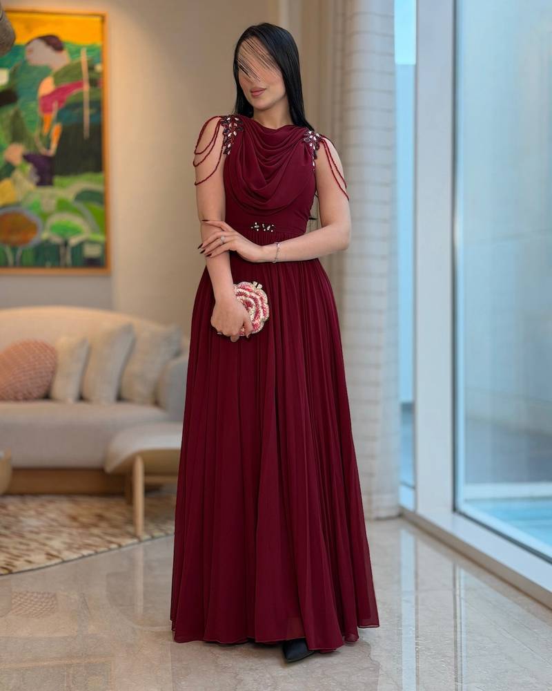 Long burgundy pleated dress with a draped collar
