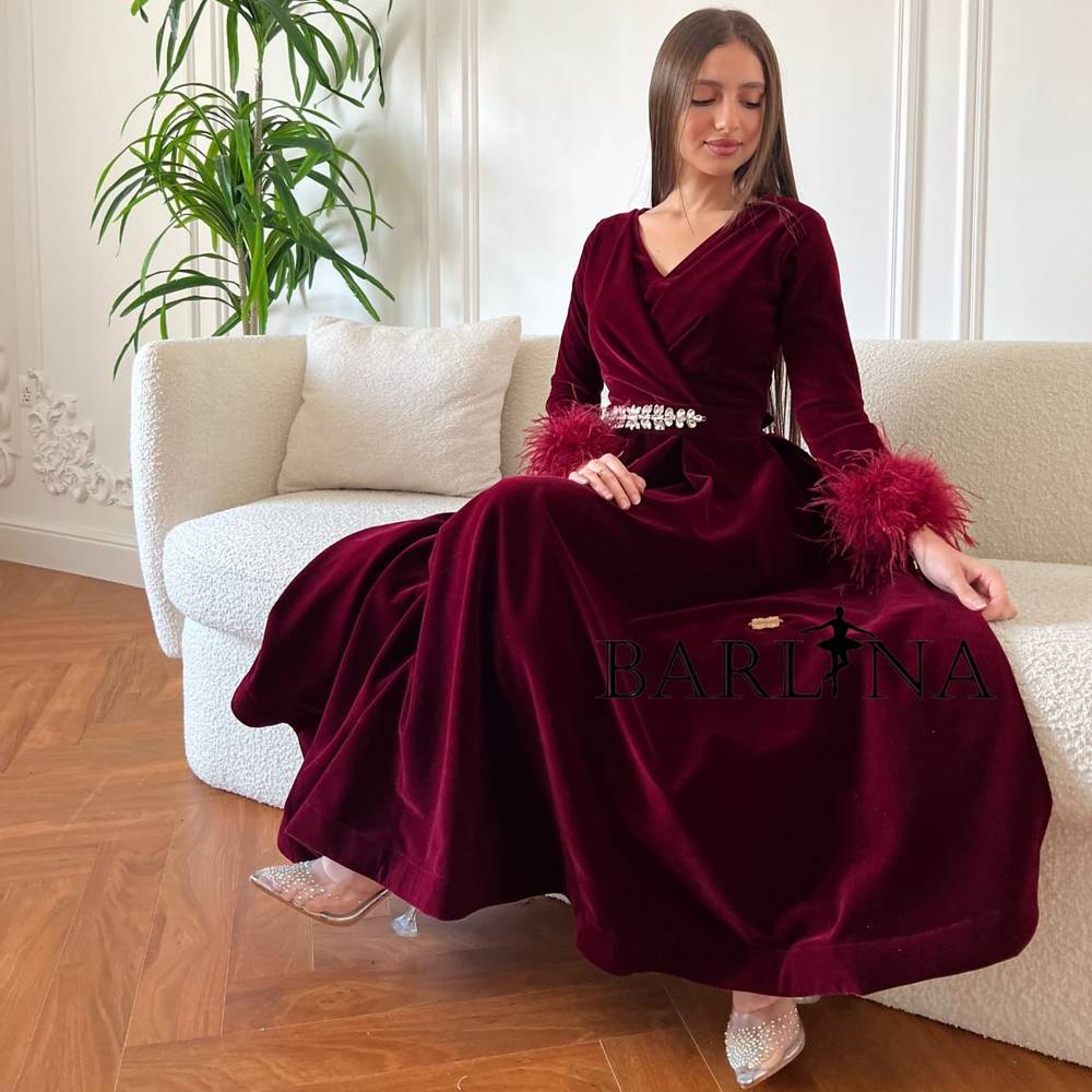 Burgundy velvet dress with feathers