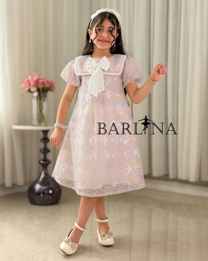 Pink girl's dress with a bow-decorated collar
