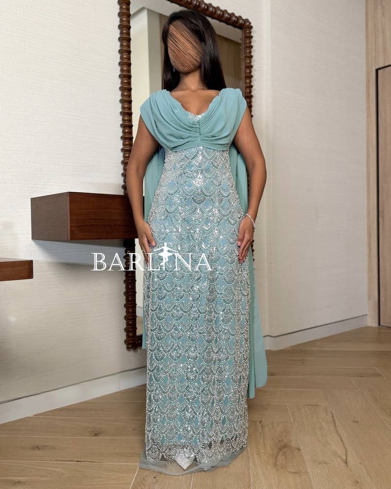 Ice blue dress with wave-shaped embroidery