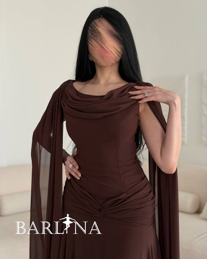 Brown dress with a long cape that drapes from the shoulders
