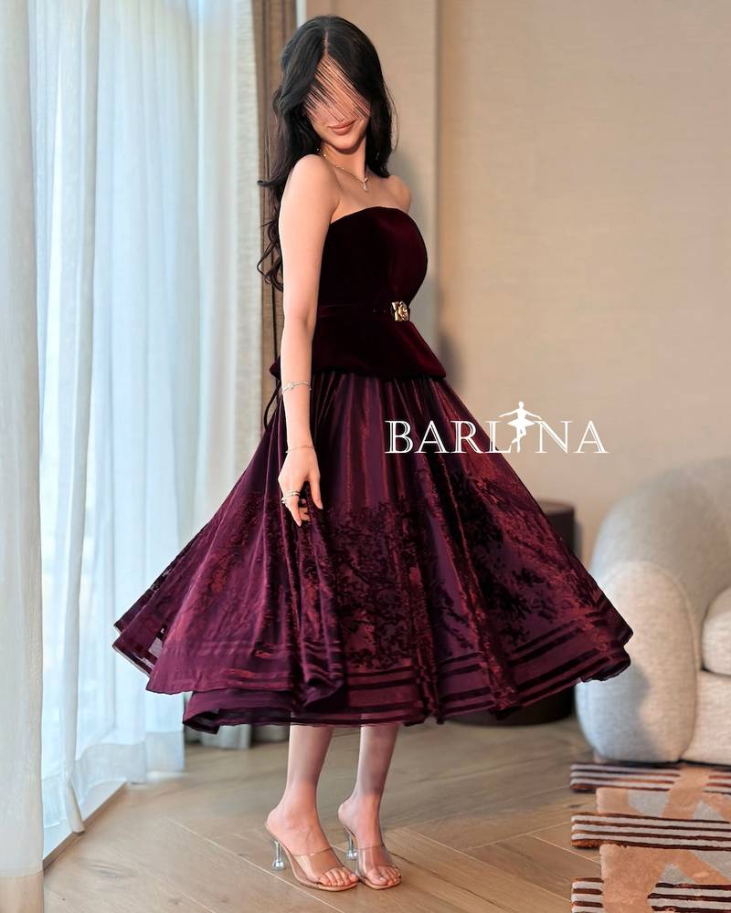 Burgundy peplum dress with a gold flower belt