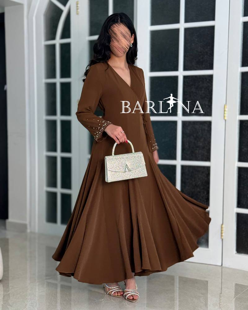A soft brown dress with sleeves adorned with pearl embroidery.