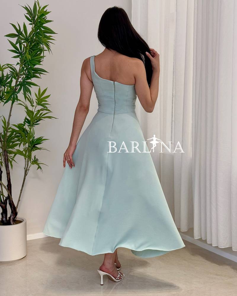 A soft Tiffany dress adorned with delicate rose embroidery