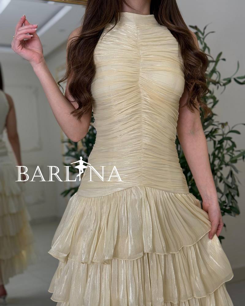 Beige dress with tiered flared skirts