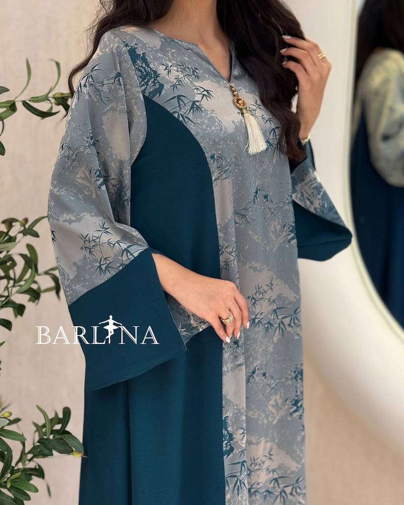 Blue jalabiya with a floral front detail