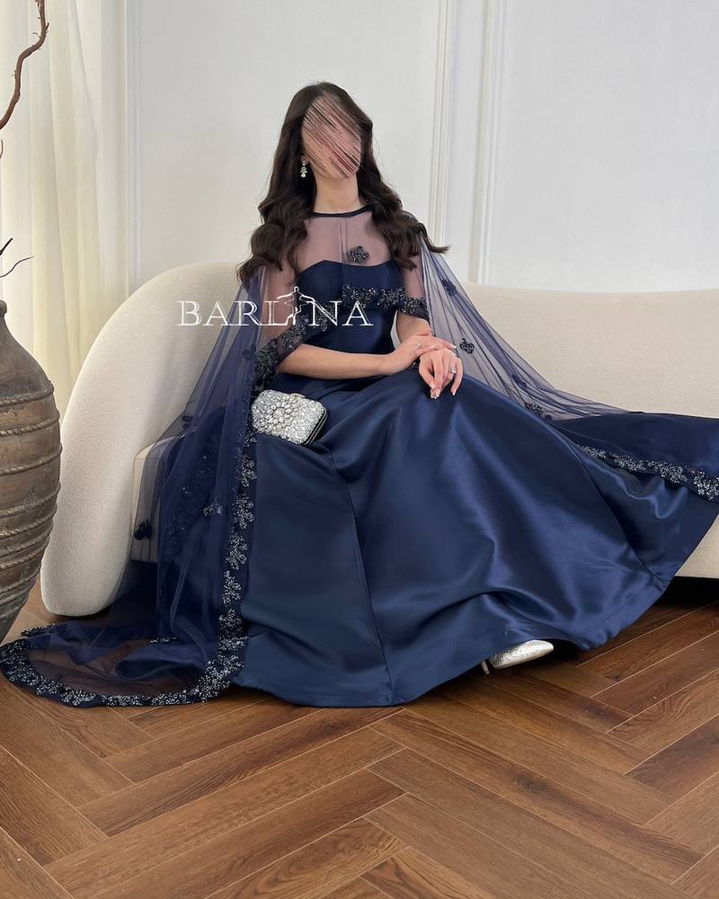 Long navy blue evening dress with a transparent cape