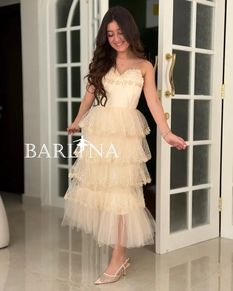 Creamy dress with layers of shimmering tulle