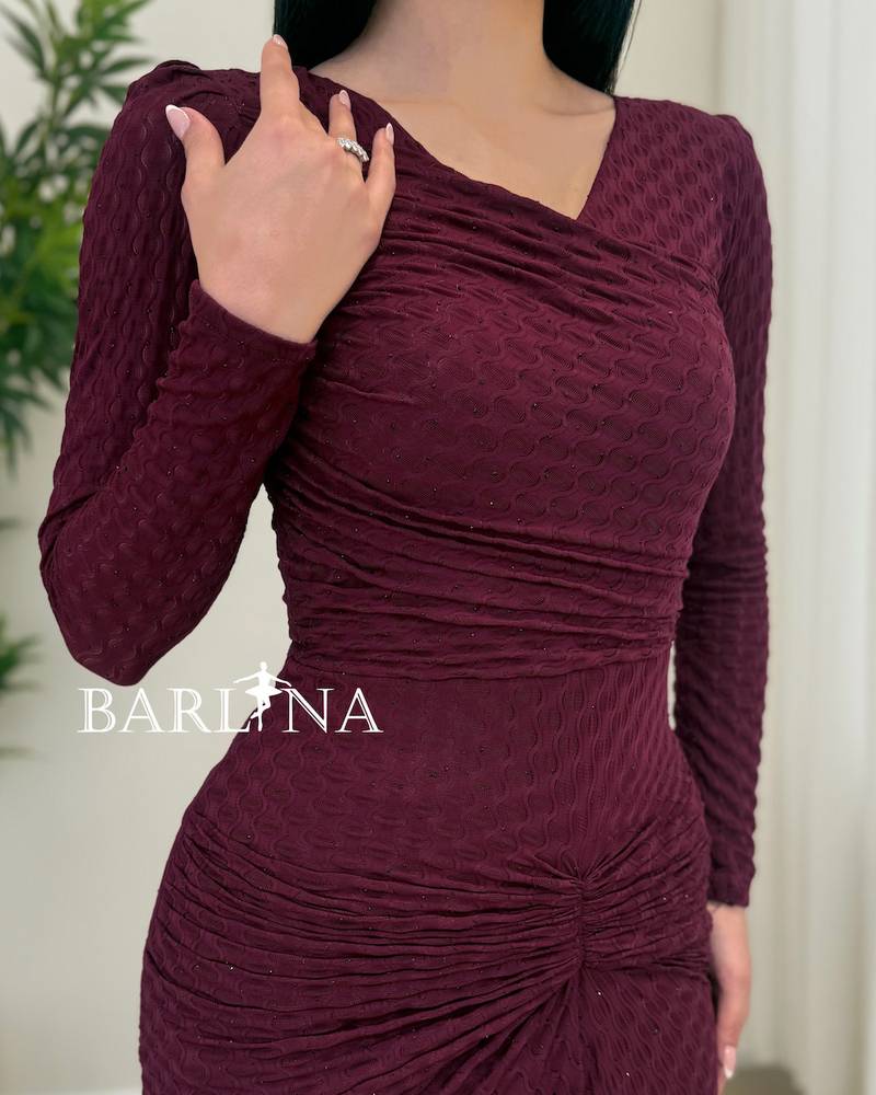 A soft burgundy dress with elegant details