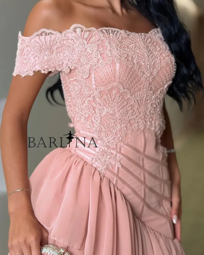 A pink dress with soft ruffles and a touch of lace.