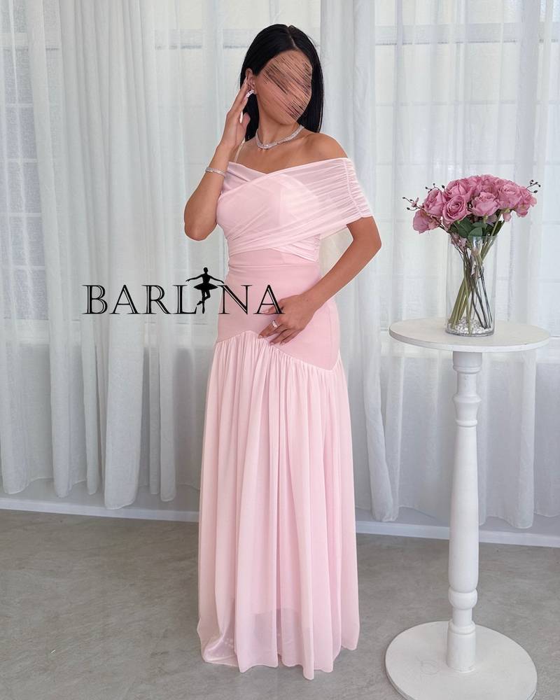 pink dress with a wrap-style off-shoulder cut