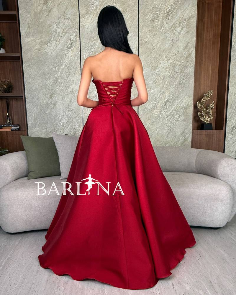 Royal red dress with luxurious embroidery on the chest