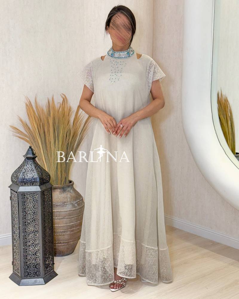 Long beige jalabiya with a bejeweled tie-neck