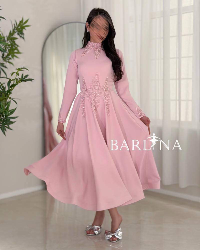 Soft pink midi dress with a feminine flared cut
