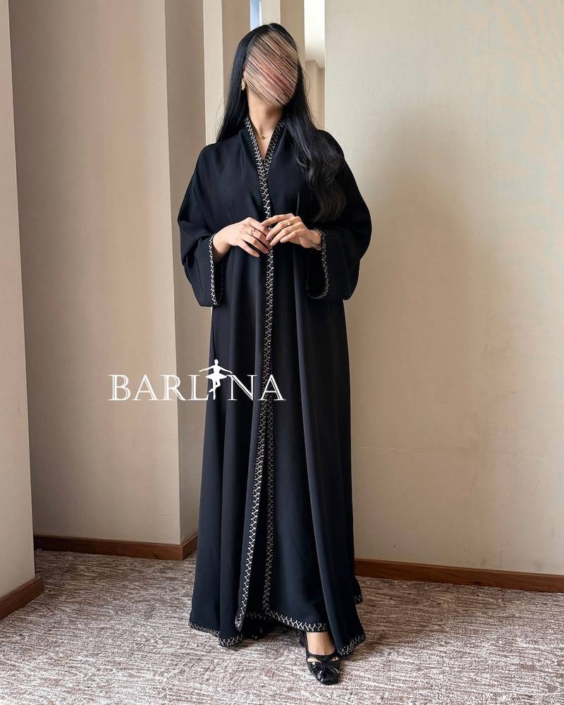 Black abaya with geometric embroidery on the edges