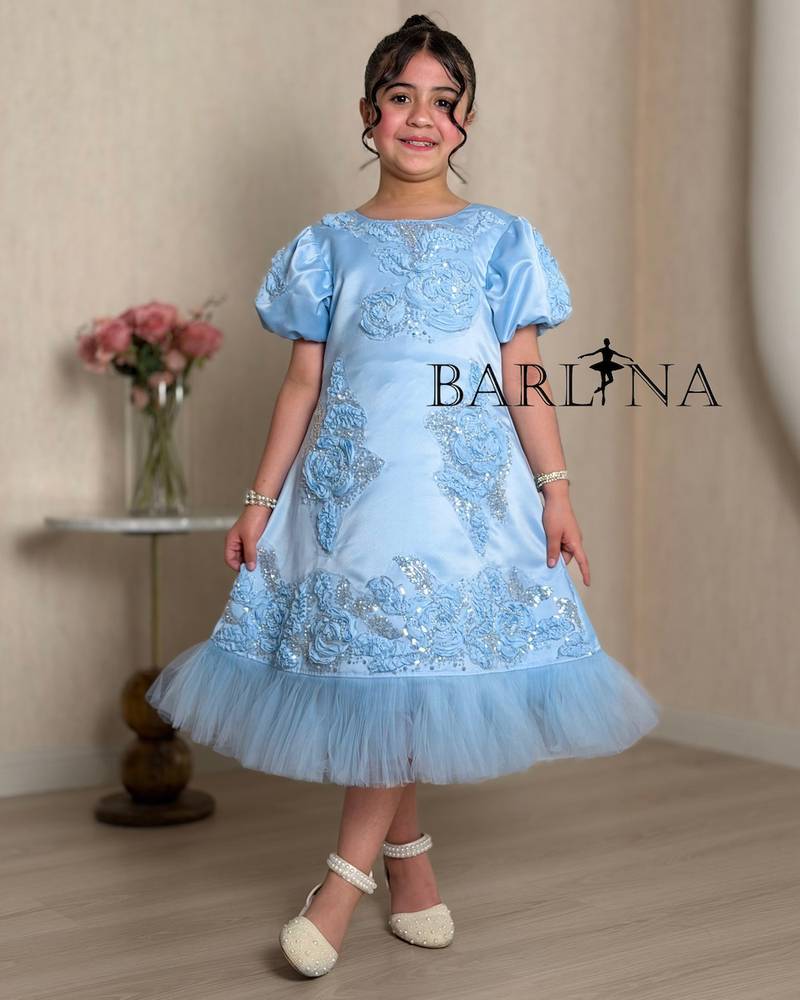 Luxurious blue girls dress with shimmering details