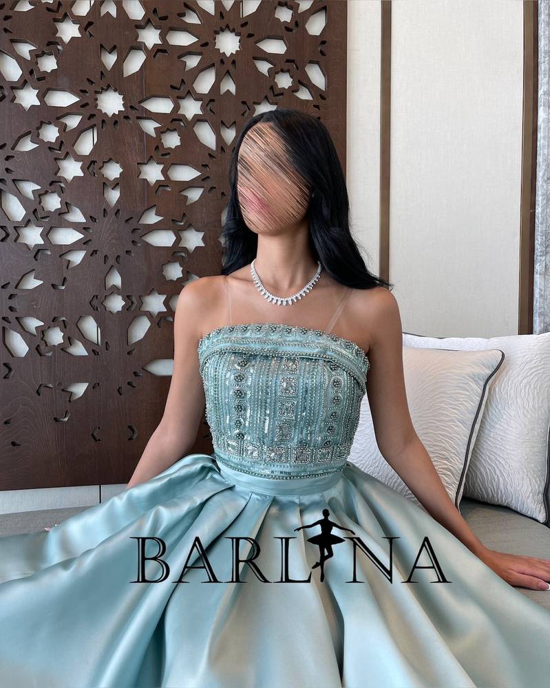Two piece dress decorated with beads and pearls