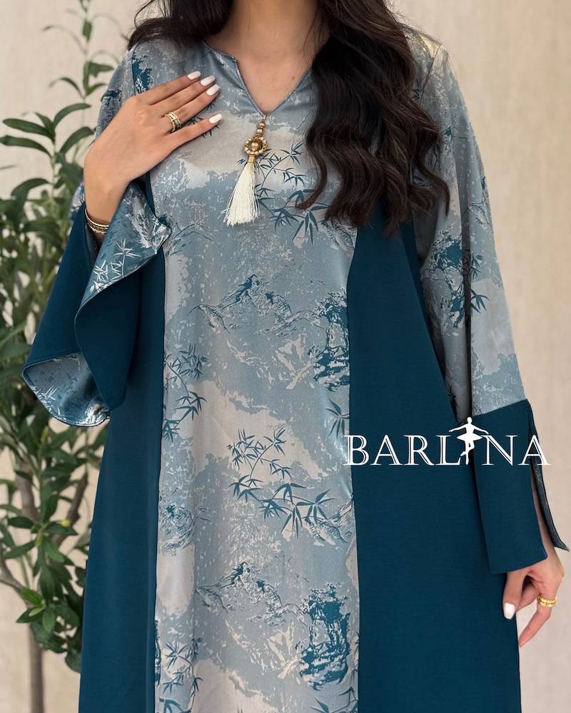 Blue jalabiya with a floral front detail