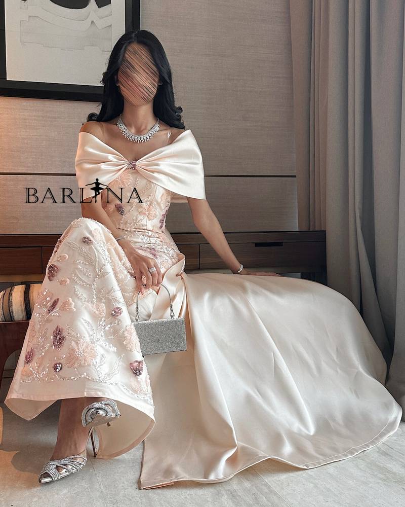Cream evening dress with an elegant back bow