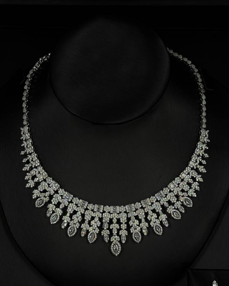 An evening accessory set intricately adorned with diamonds