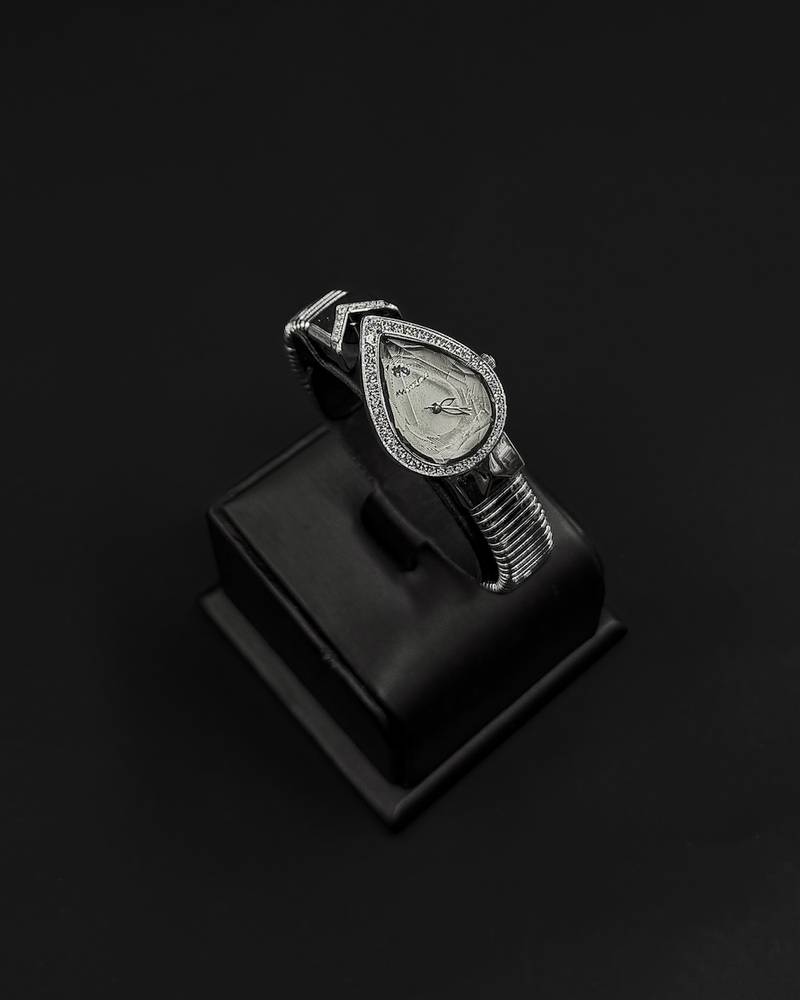 A luxurious women's watch in the shape of a teardrop