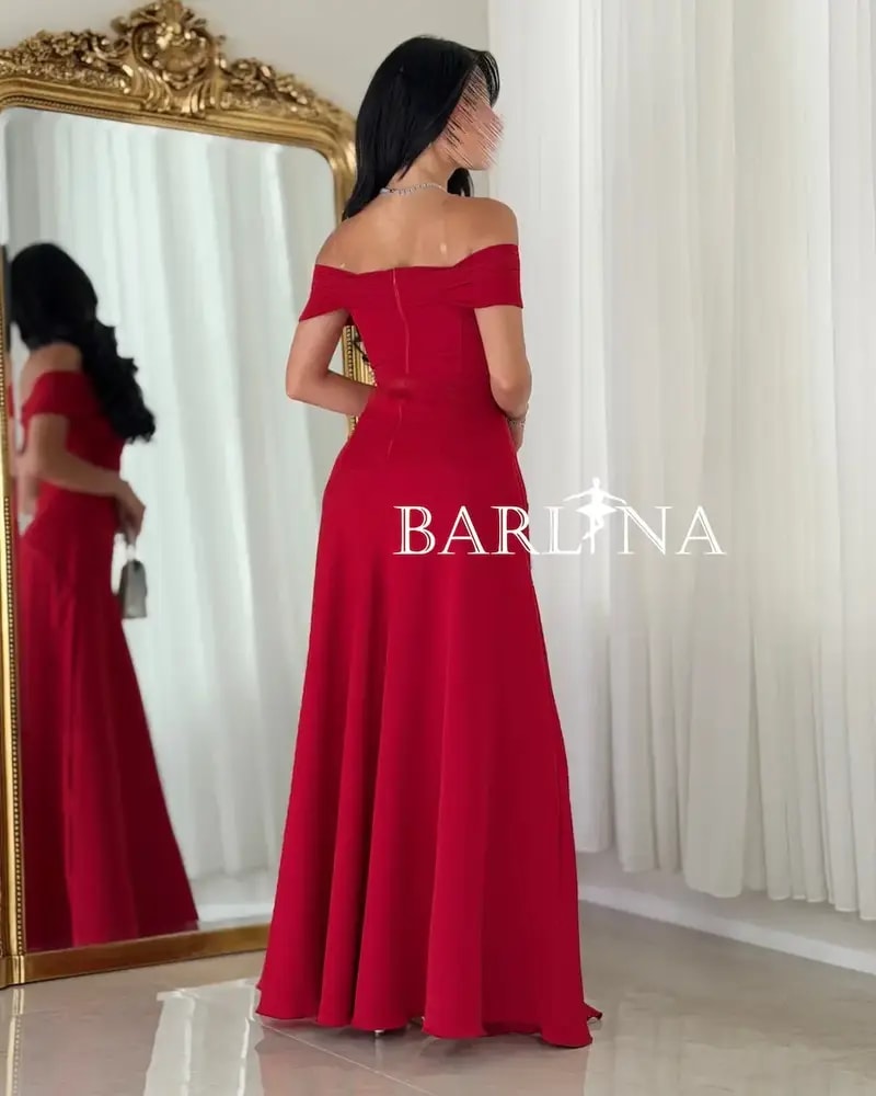 Long red dress with a flowing off-the-shoulder design