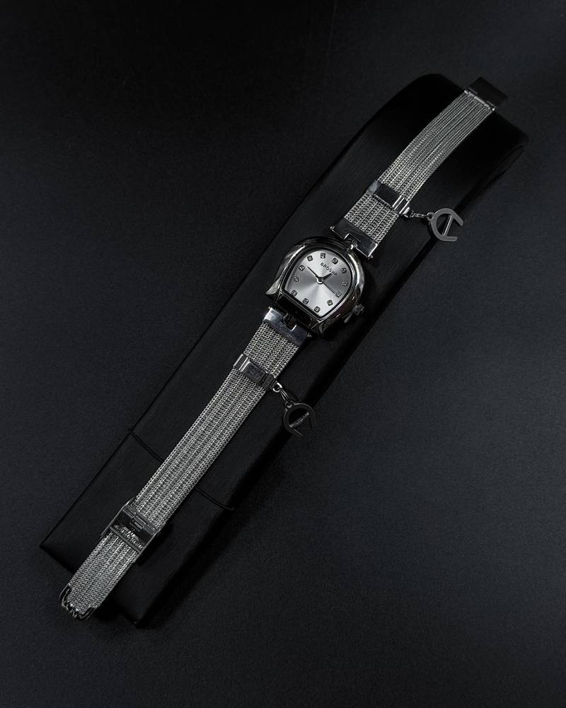 Elegant women's watch adorned with a charm