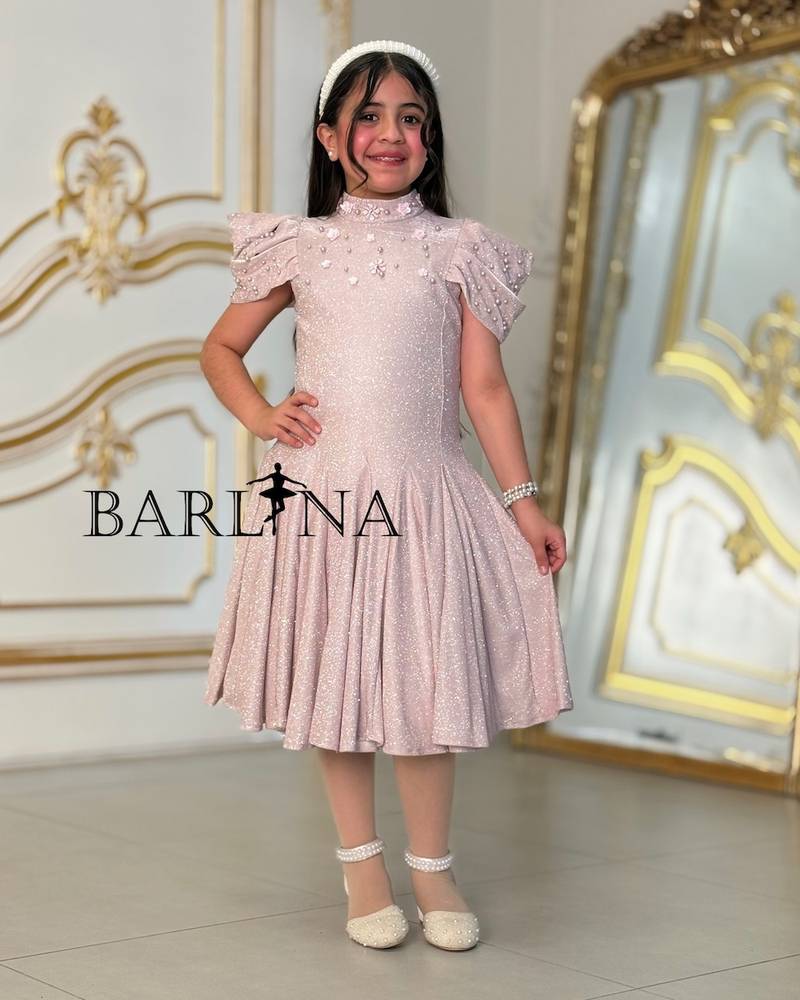 A sparkly girl's dress decorated with pearls