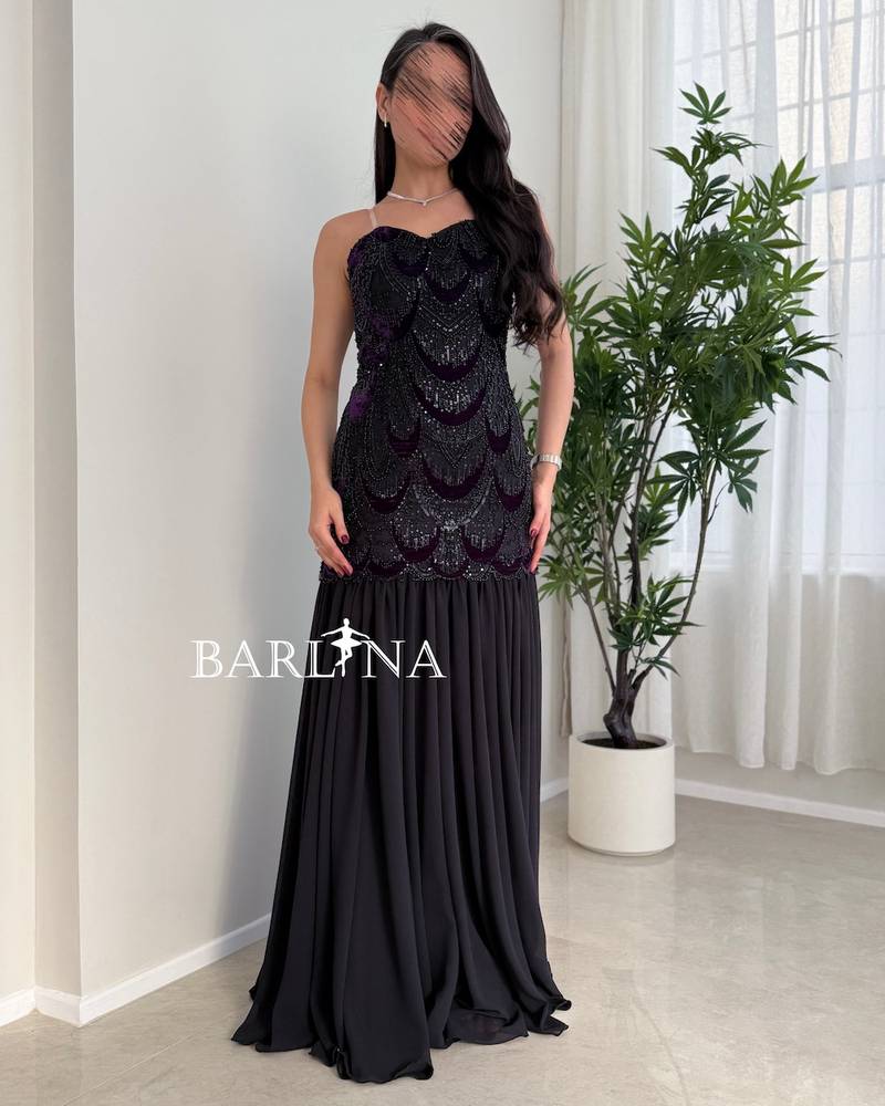 Black dress with a sequined embroidered sweetheart neckline
