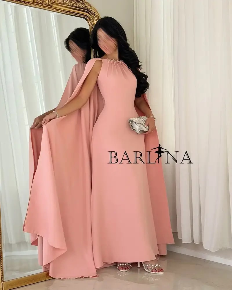 Pink occasion dress with a wide cape