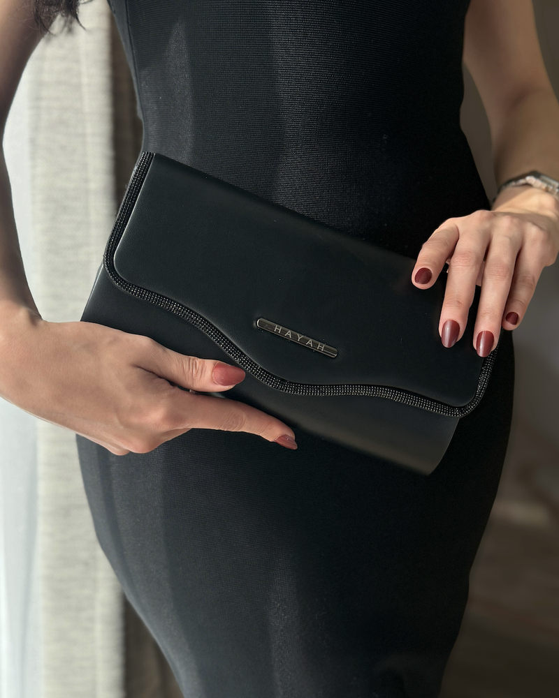 Clutch bag decorated with crystal trim