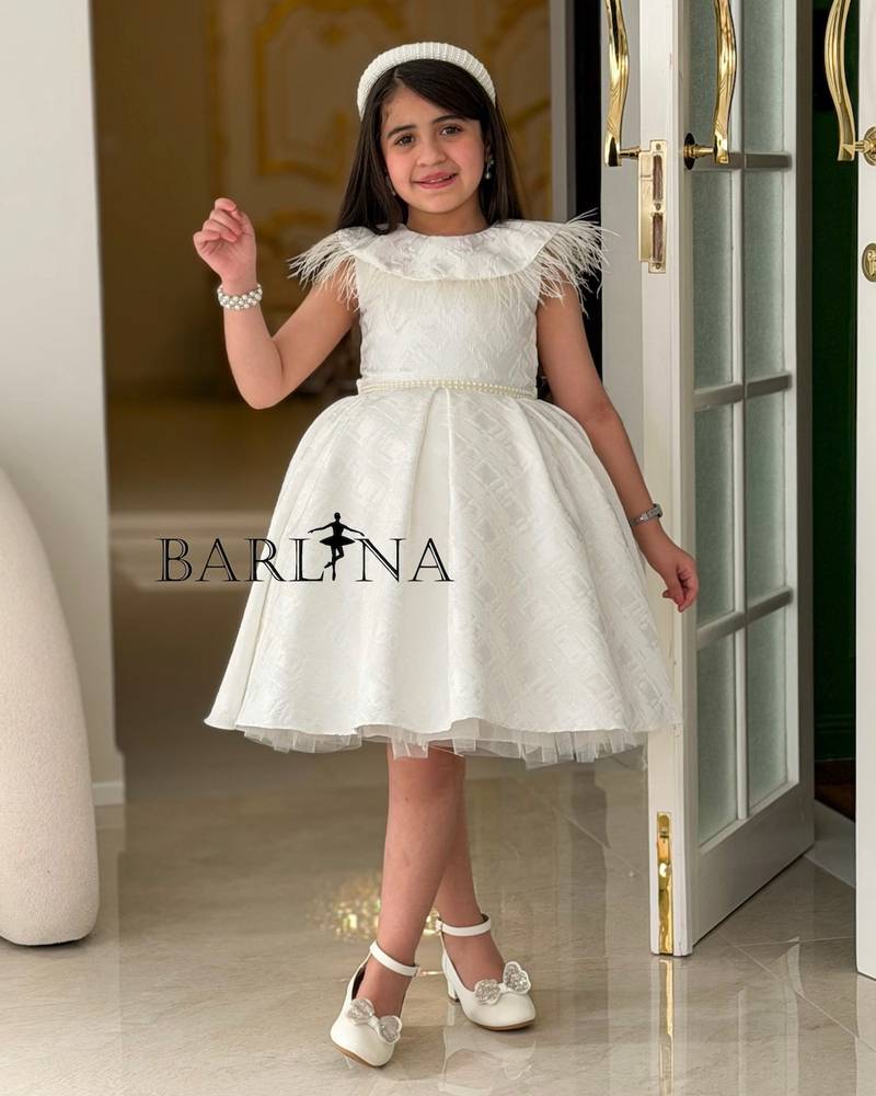 white girl's dress with a feather-trimmed collar