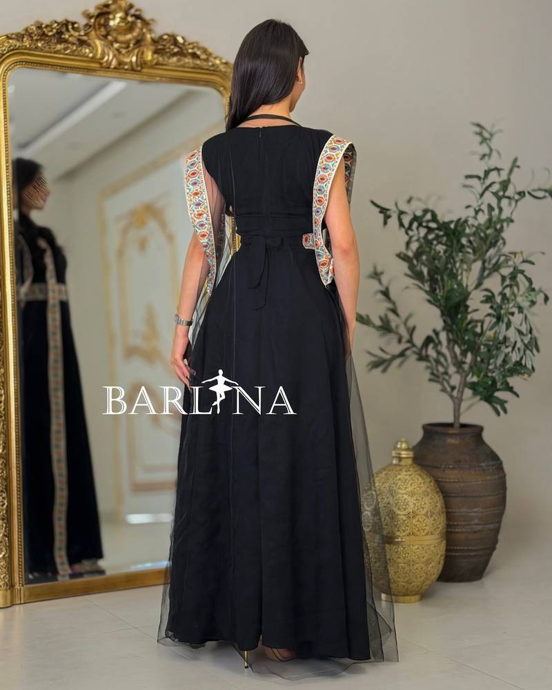 Black jalabiya with colorful traditional embroidery