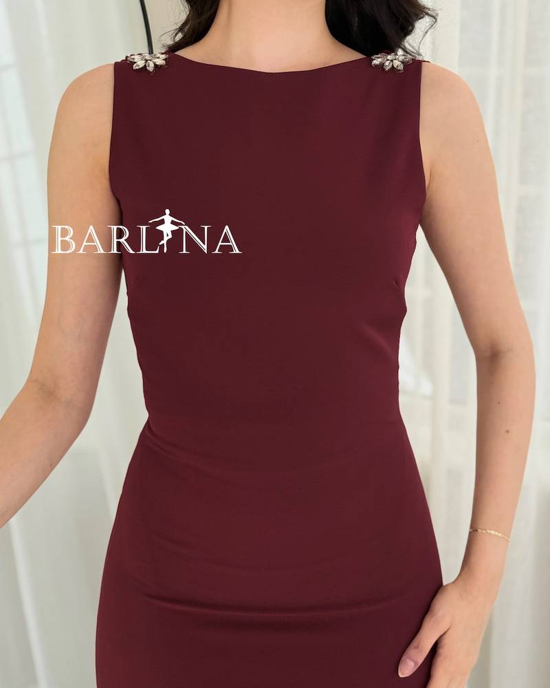 A soft burgundy dress adorned with crystal details