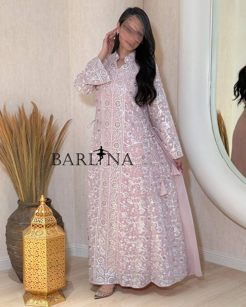 jalabeya with white embroidery and a side tie