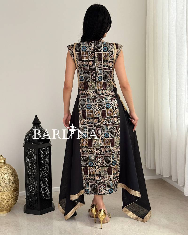 Black jalabiya with traditional embroidery and gold accents