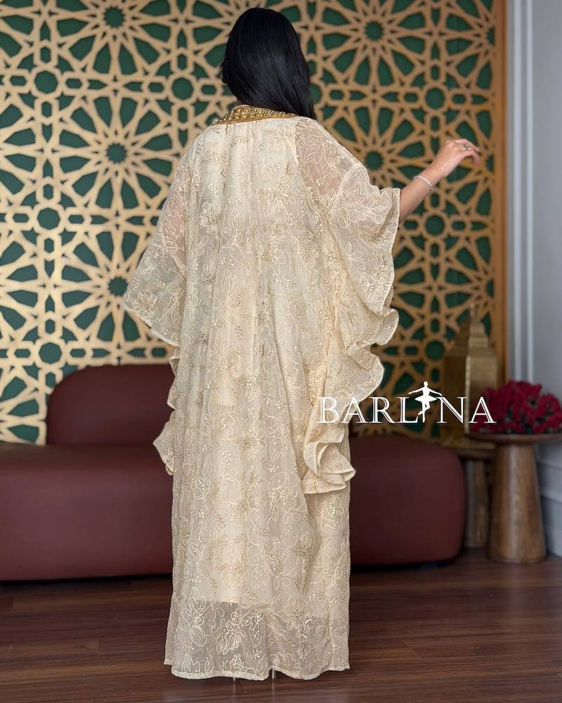 Beige jalabiya with a gold-embroidered lace shawl