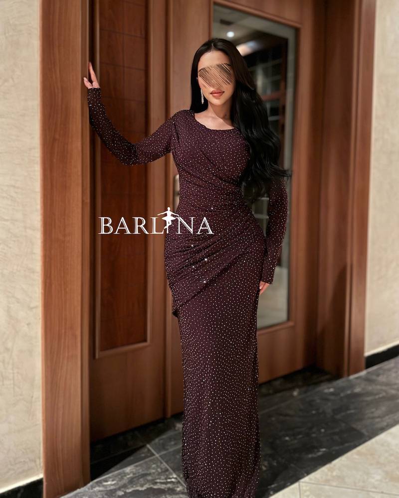 Long, fitted dress with delicate embroidery
