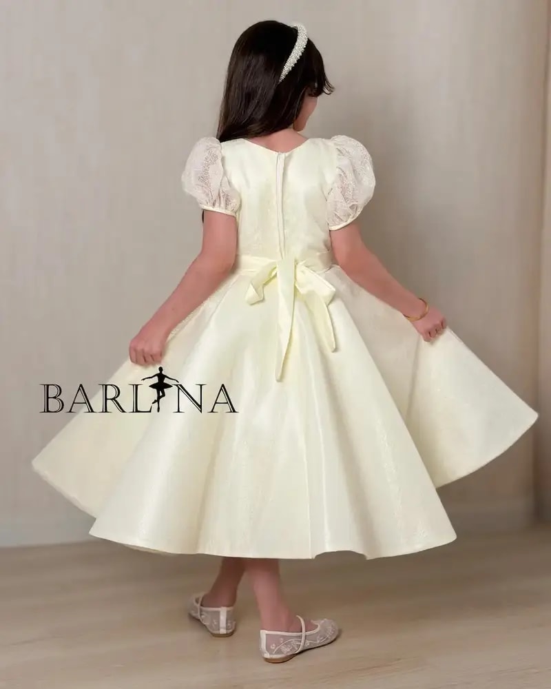 Lemon-colored girls' dress with elegant embroidery details