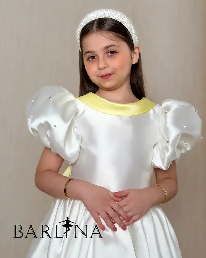 Girls' white evening dress with a yellow touch