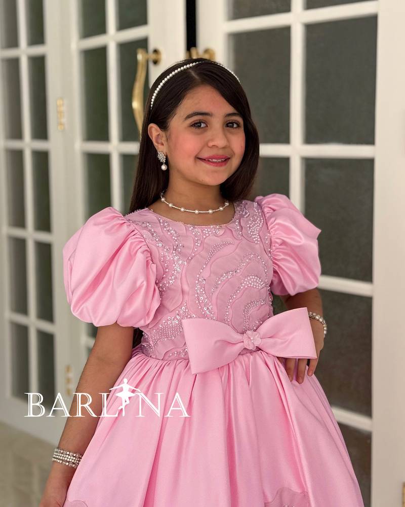 Soft pink girls' dress with a puffy cut